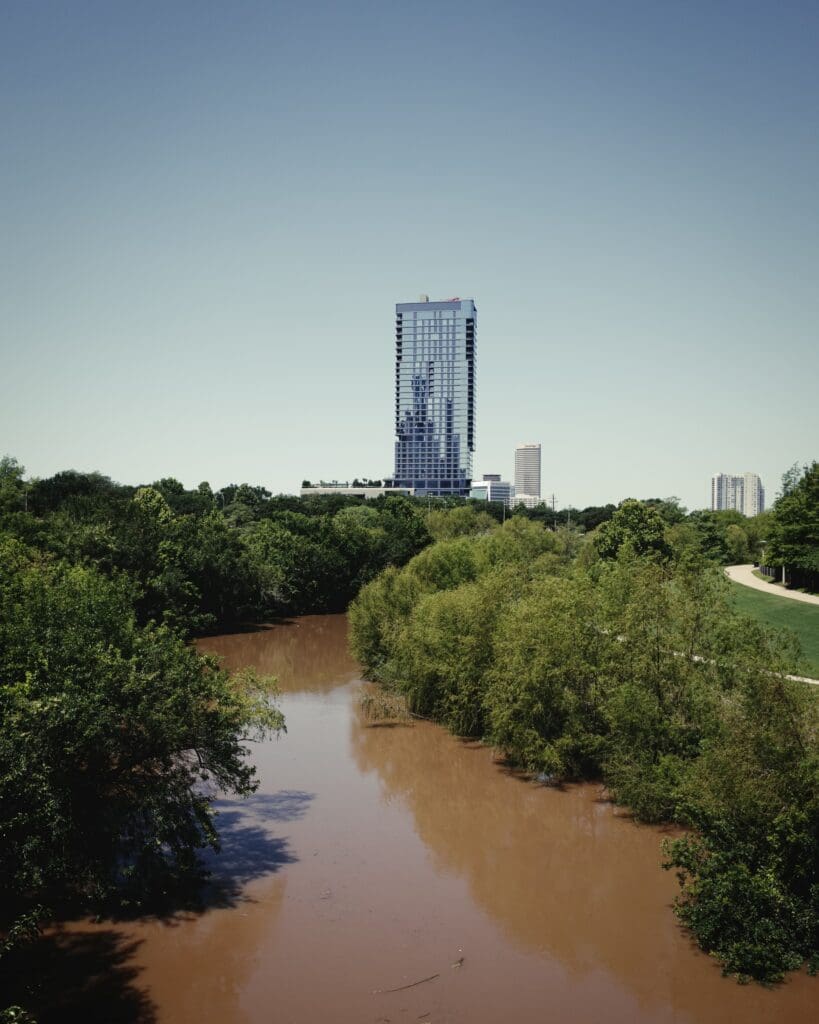 Buffalo Bayou Houston Texas with high brown floodwater after heavy rain — Houston flooding and drainage