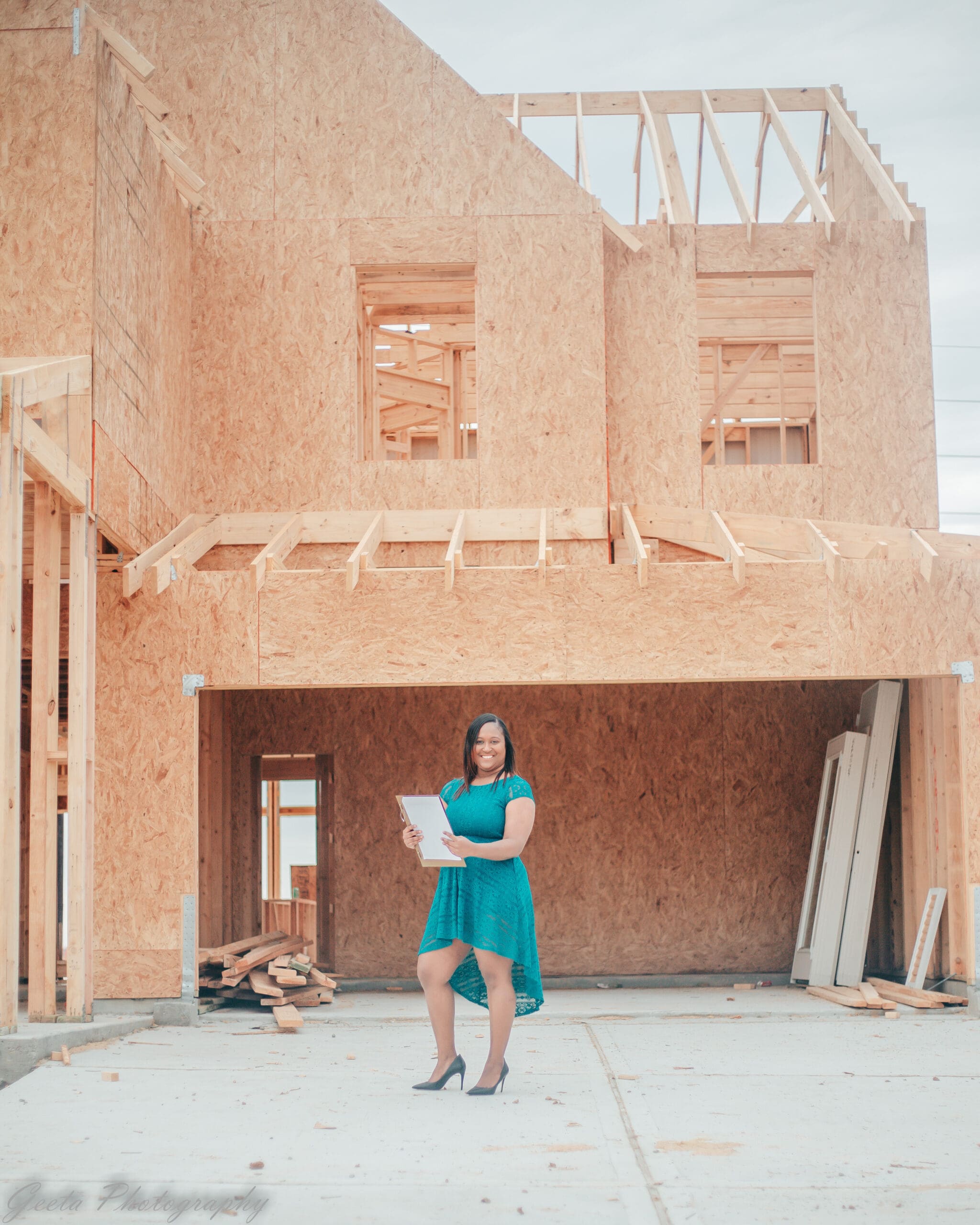 Crystal Plummer Spruill Katy Houston TX real estate agent standing in front of new construction home