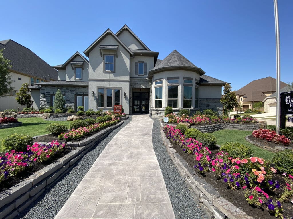 Luxury new construction home with stucco and stone exterior in Katy Texas — Houston Housing 101 architectural styles