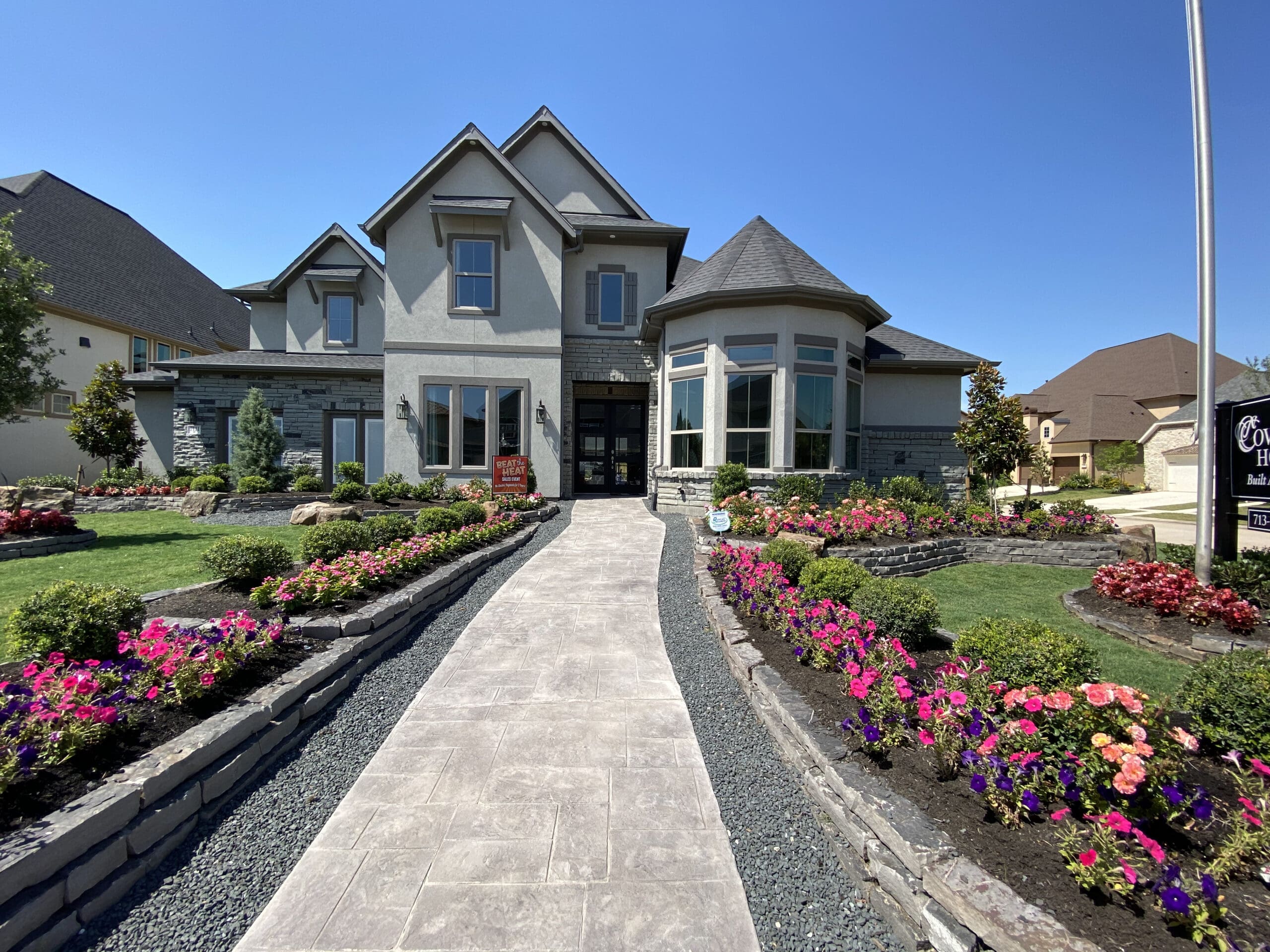 Luxury new construction home with stucco and stone exterior in Katy Texas — Houston Housing 101 architectural styles