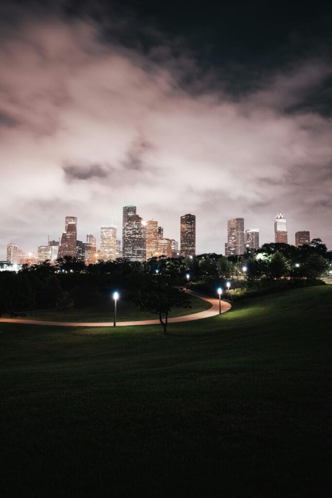 Houston Texas skyline at night with dramatic storm clouds — Houston weather storms and hurricane season