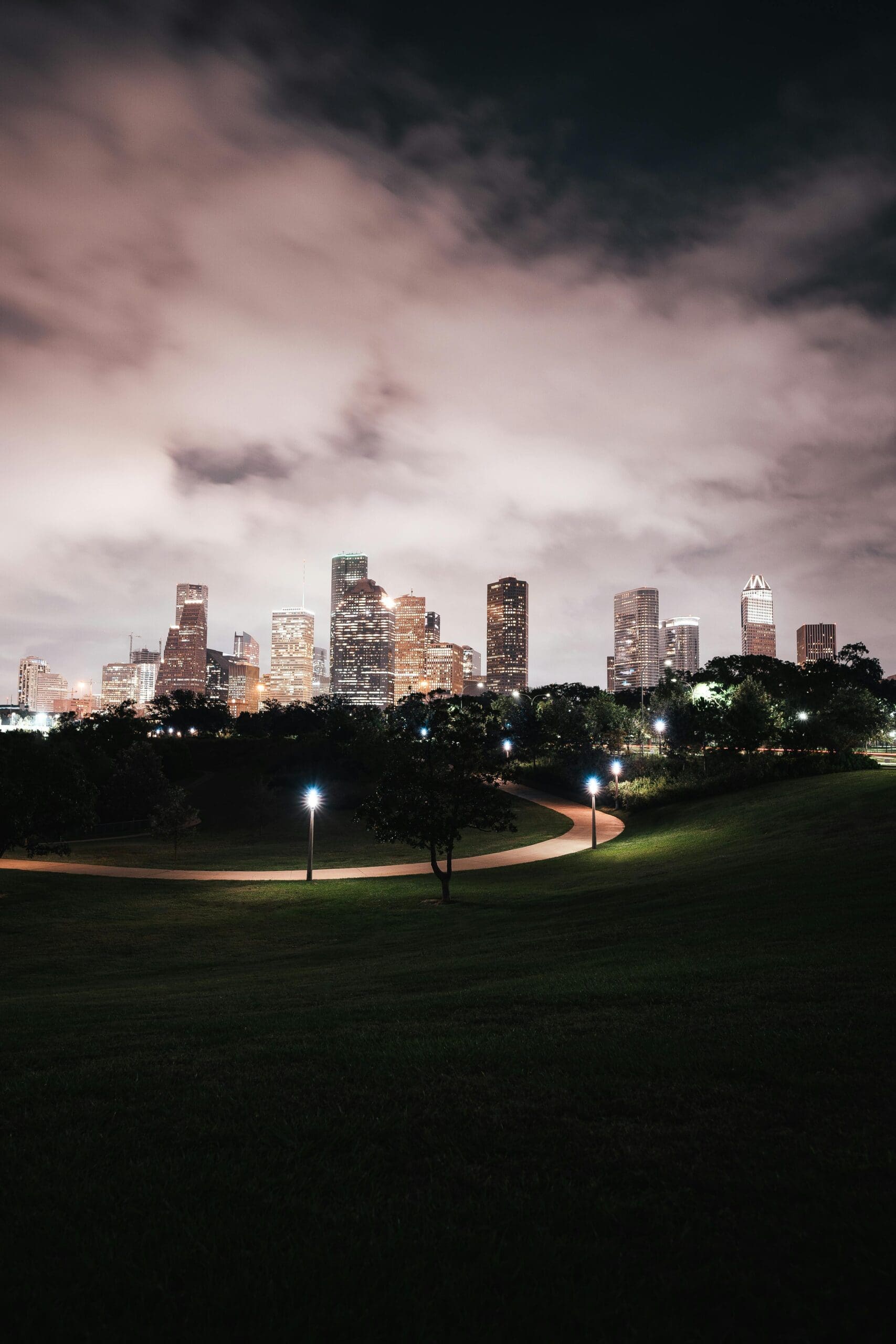 Houston Texas skyline at night with dramatic storm clouds — Houston weather storms and hurricane season