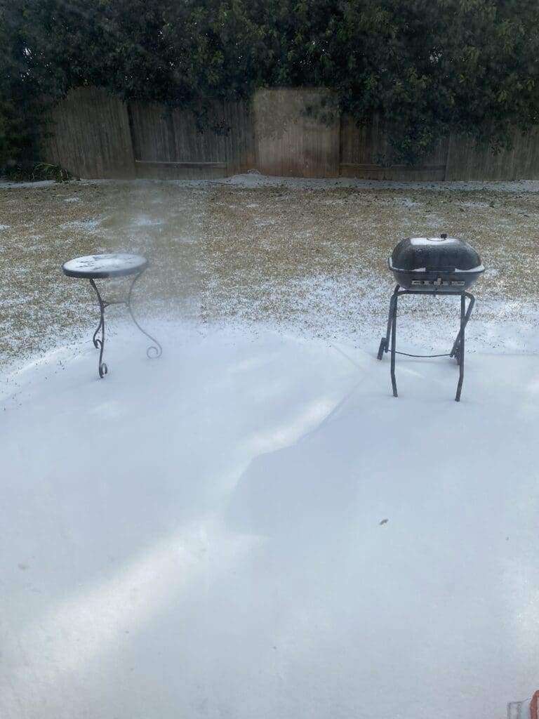 Houston Texas weather app showing Winter Storm Warning at 28 degrees — Houston winter storm and freeze history